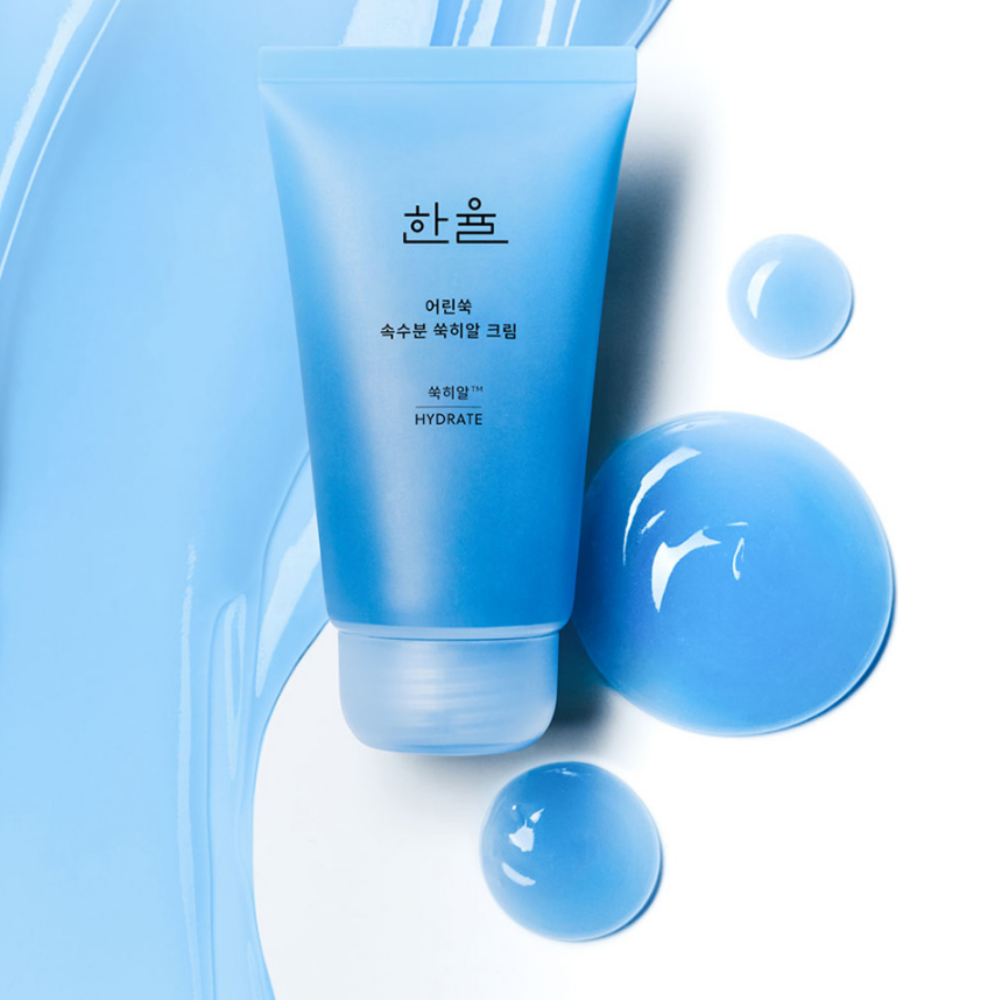 HANYUL Young Artemisia Extract Moisturizing Cream 60ml tube on blue background with texture and liquid drops