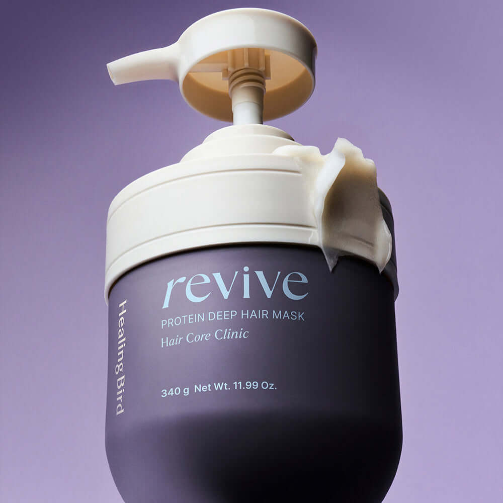 HEALING BIRD Revive Protein Shampoo + Deep Hair Mask bottle on purple background