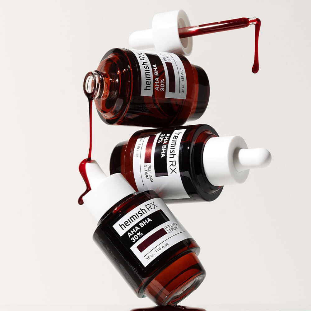 Three bottles of HEIMISH RX AHA BHA Peeling Serum 35ml with droppers, highlighting serum texture and packaging design.