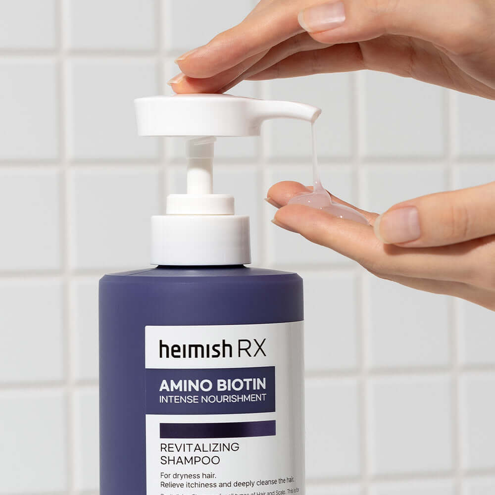 HEIMISH RX Amino Biotin Revitalizing Shampoo 400ml bottle in use against tiled background