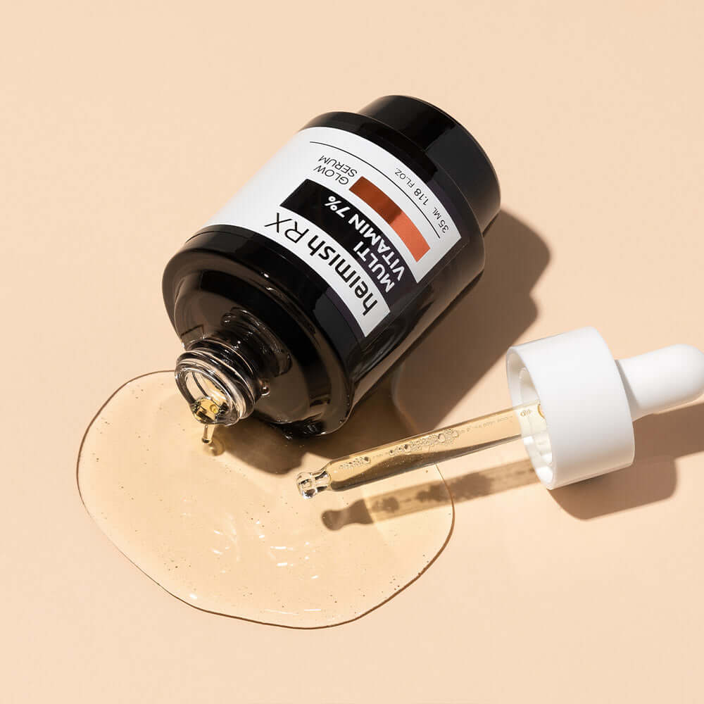 HEIMISH RX Multi Vitamin Glow Serum 35ml bottle with dropper against a beige background, highlighting skincare serum texture and packaging.