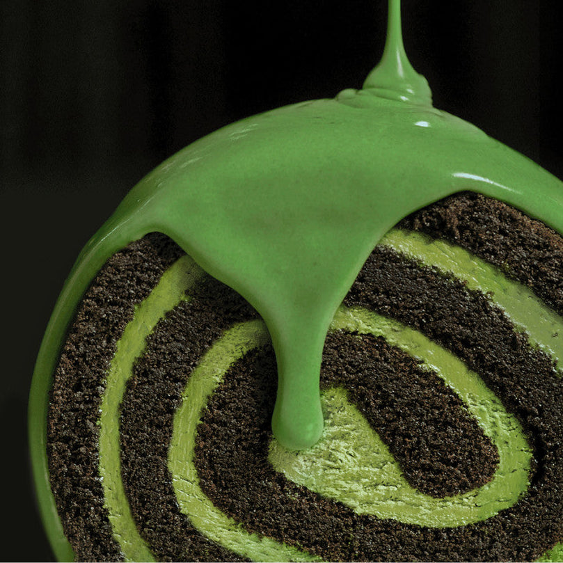 HIT THE TEA Super Matcha Black Roll Cake Gluten-Free with green icing, showcasing spiral pattern. Perfect for desserts and treats.