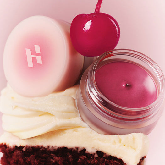 HOLIKA HOLIKA Melting Blur Lip Pot 5g in a glass jar with cherry and cake as background