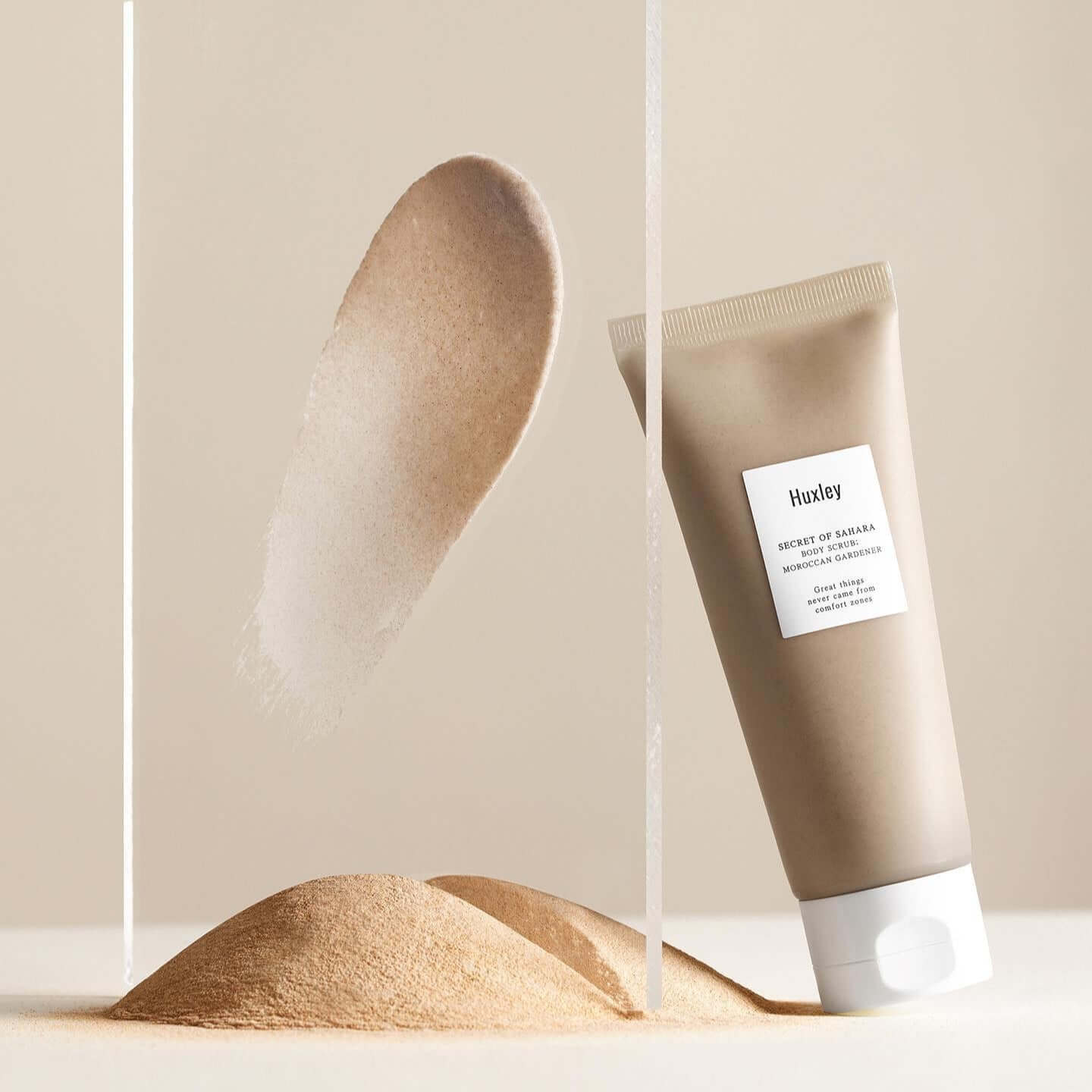 HUXLEY Body Scrub Moroccan Gardener cream with sand and transparent panel for a luxurious skincare experience.