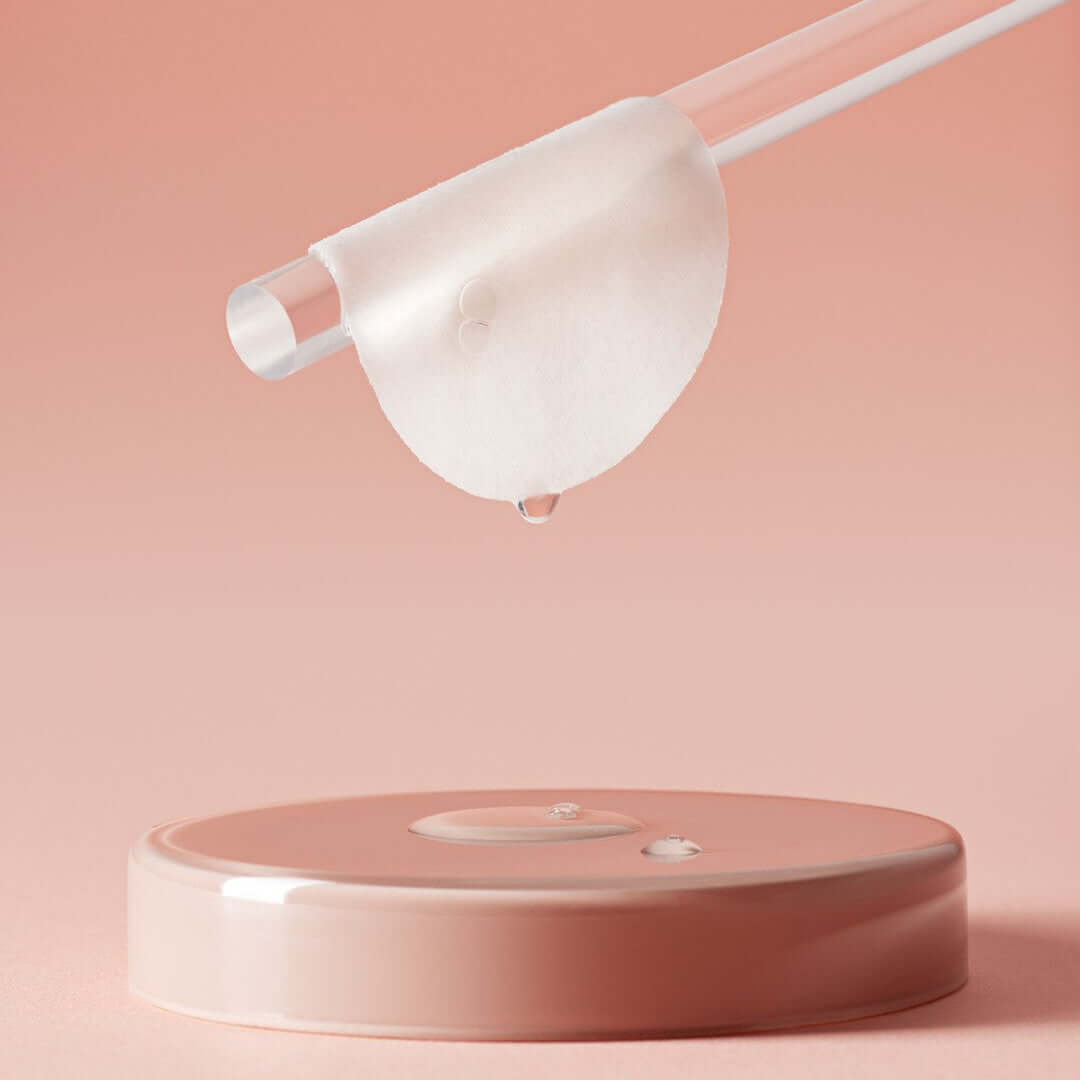 HUXLEY Conditioning Pad Every Moment placed on a sleek pink surface