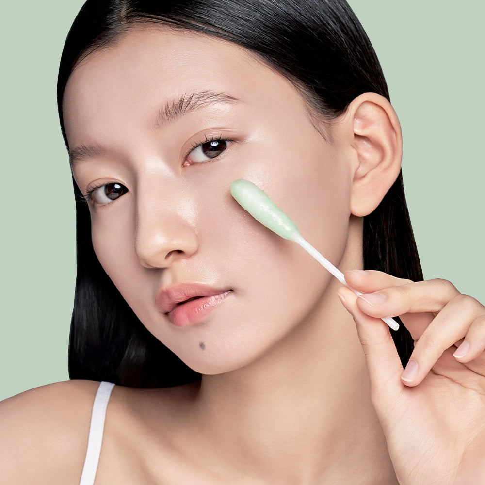 Woman using ILSO No Trouble Peeling Swab 8 sheets for skincare routine