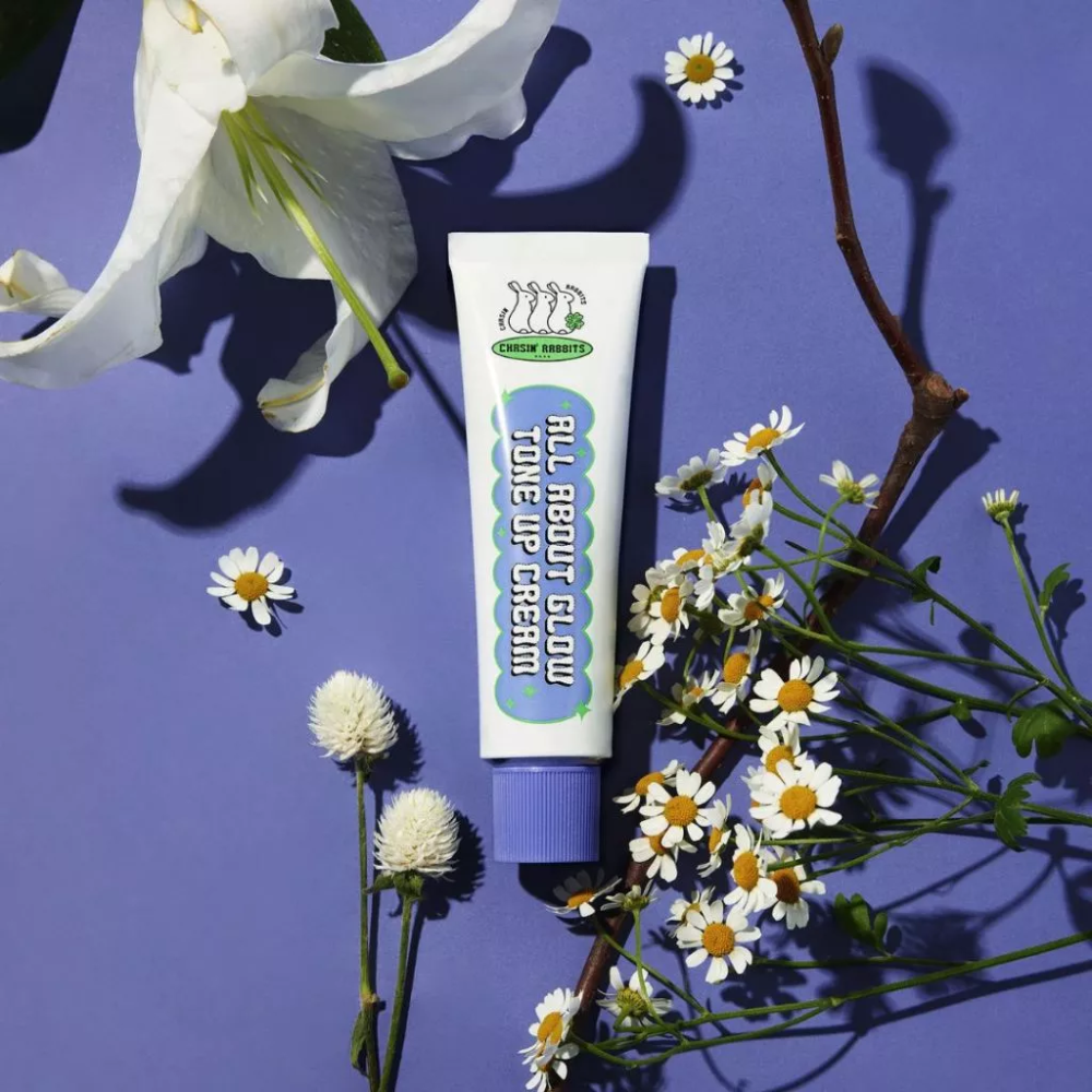 IT'S SKIN All About Glow Tone Up Cream with flowers on purple background