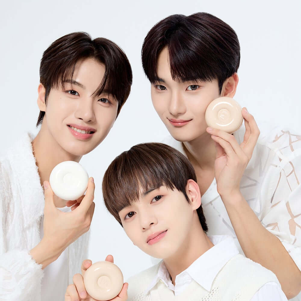 Three people holding IVI MAD PEACH Plain Velvet Matte Cushion with smiles, showcasing the product's attractive design for beauty enthusiasts.