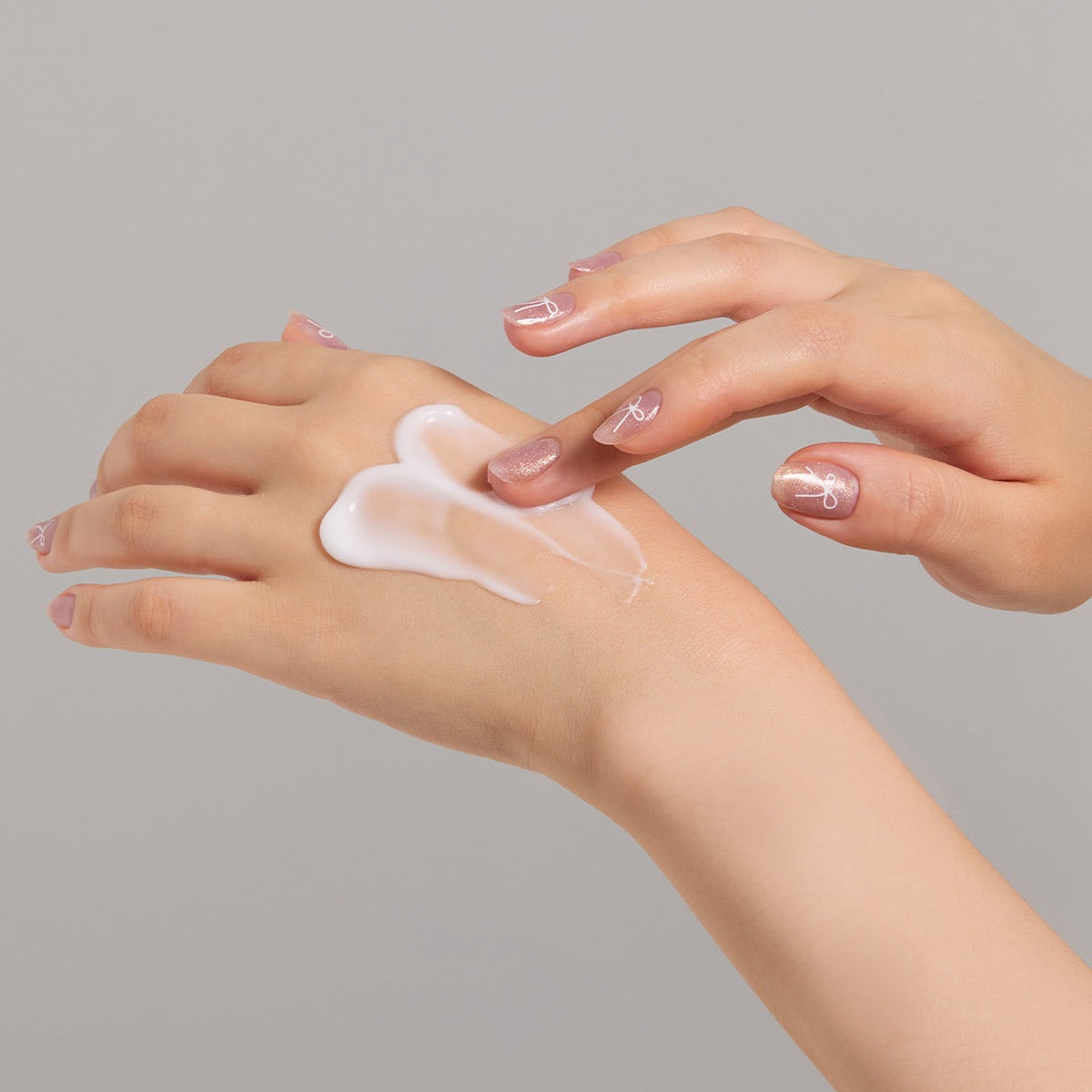 Applying JULYME Perfume Shea Butter Hand Cream 30ml on hands for soft skin