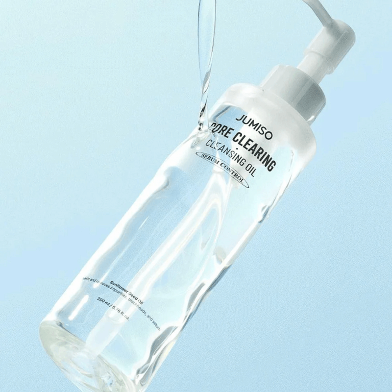 JUMISO Pore Clearing Cleansing Oil 200ml bottle with pump dispenser on a light blue background.