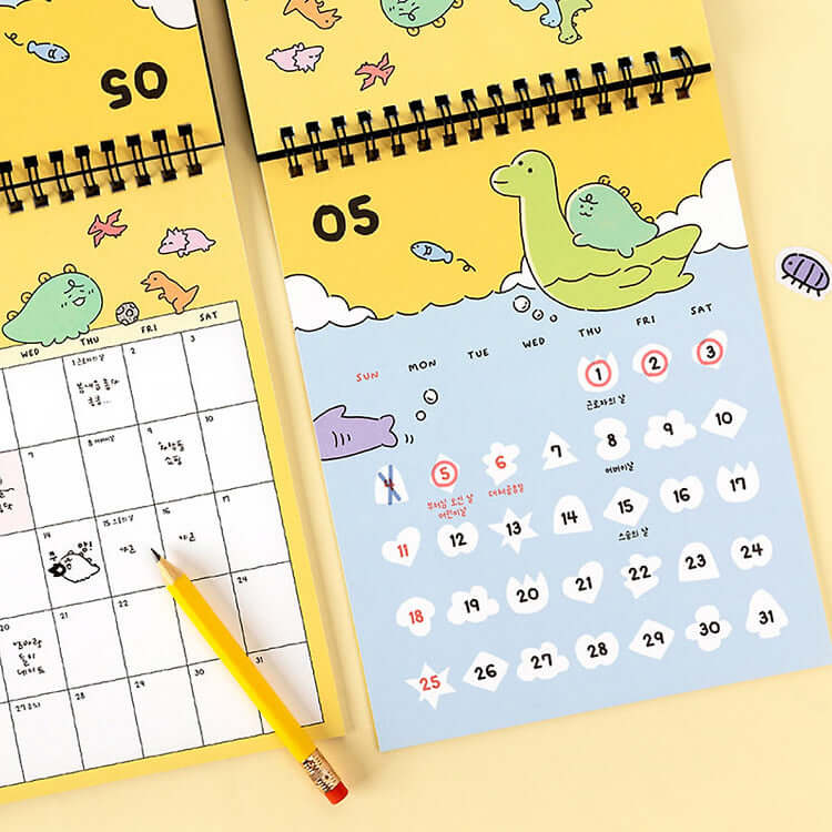 KAKAO FRIENDS Jordi Dino 2025 Calendar open to May, featuring playful dinosaur illustrations with yellow and blue themes.
