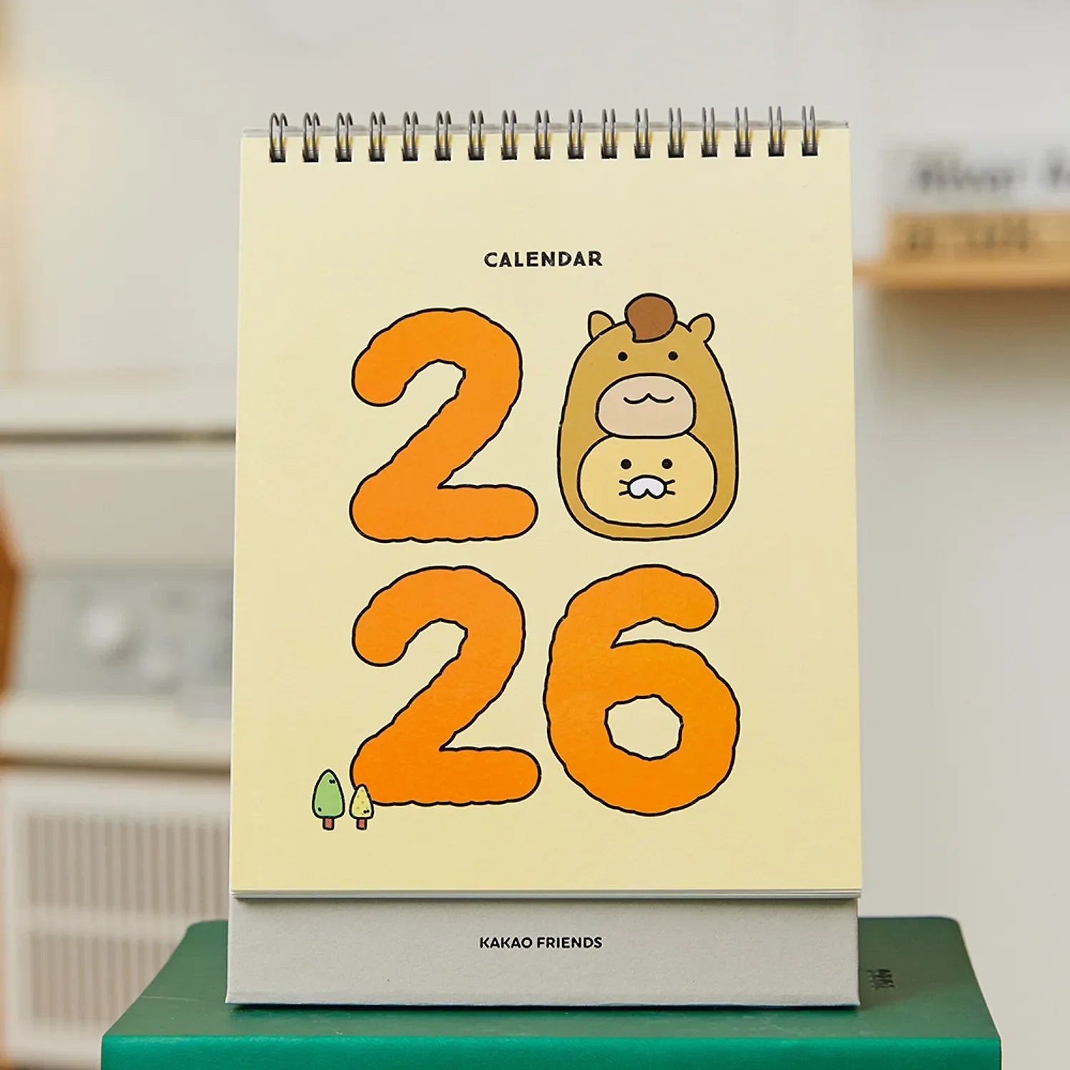 KAKAO FRIENDS Desk Calendar 2026 with cute character design shown on a desk setting.