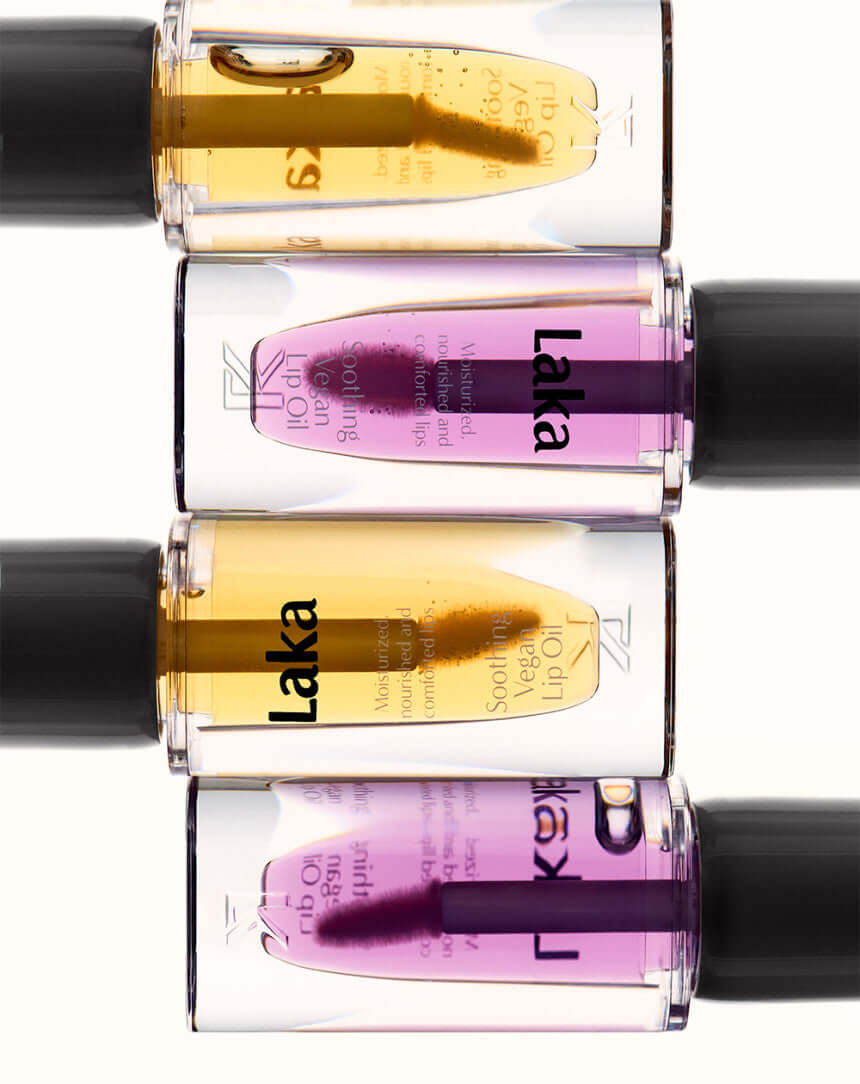 Close-up of LAKA Soothing Vegan Lip Oil bottles in assorted colors.