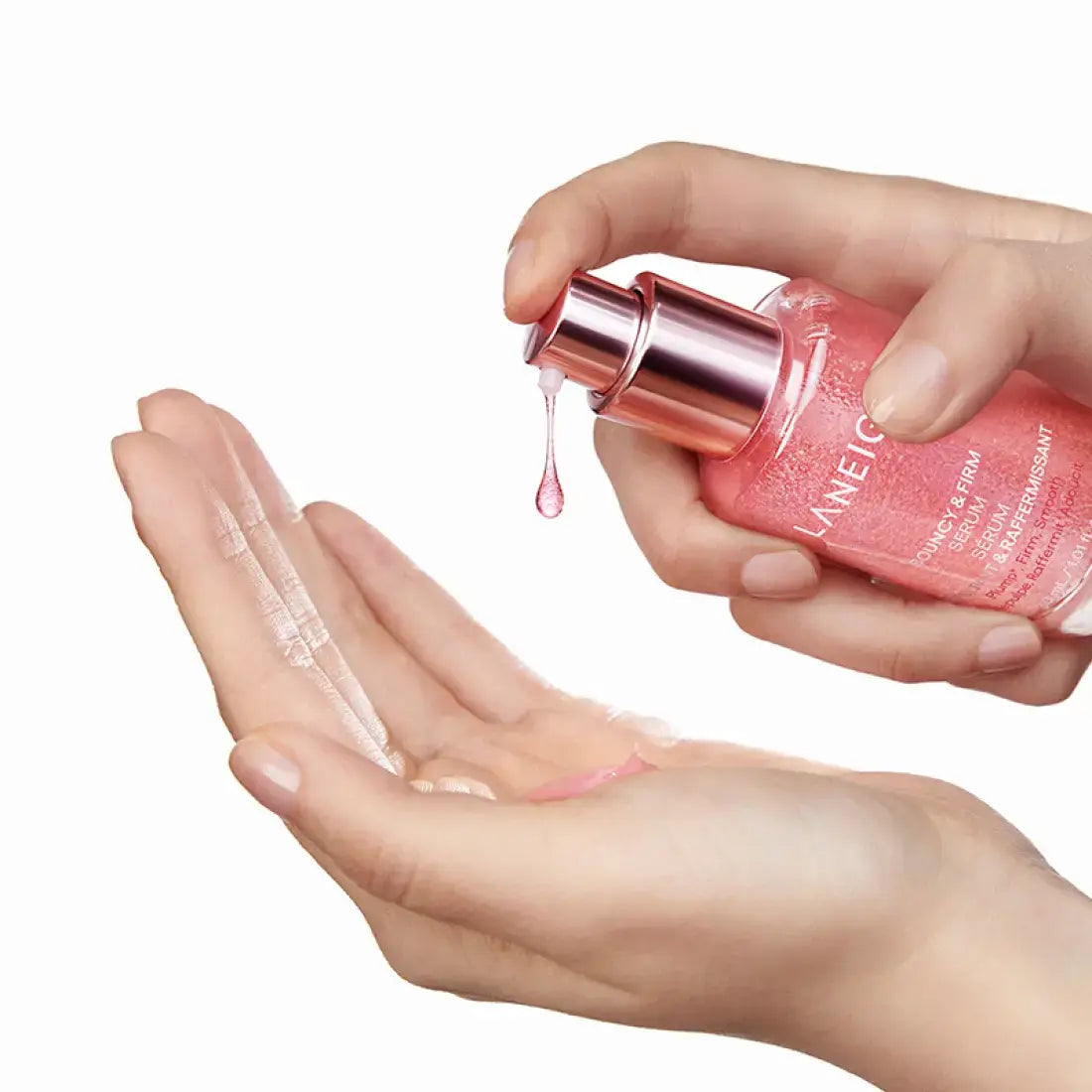 Applying LANEIGE NEW Bouncy & Firm Serum 30ml to hands, showcasing the product's texture and packaging.