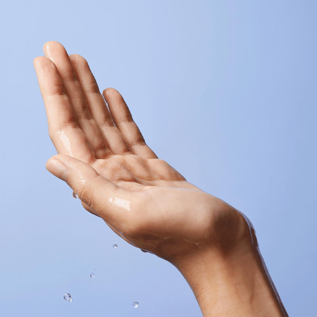 A hand with water droplets showcasing hydration, emphasizing the LANEIGE Water Bank Gentle Gel Cleanser 250ml's moisturizing effects.