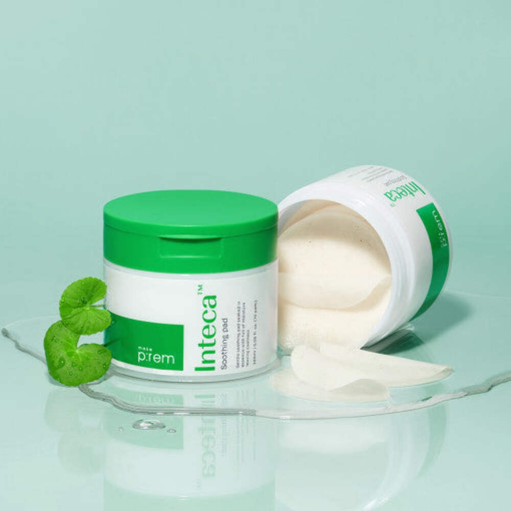 MAKE P:REM Inteca Trouble Soothing Pads 70 sheets in green packaging with open lid, highlighting soothing pads and botanical elements.
