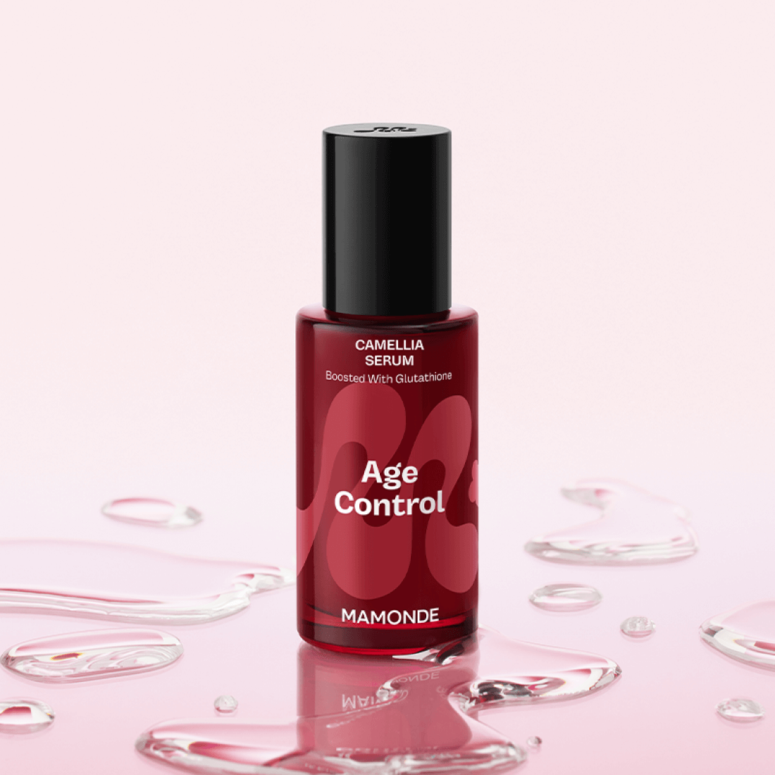 MAMONDE Age Control Camellia Serum 50ml bottle against a pink background with water droplets, highlighting skin hydration benefits.