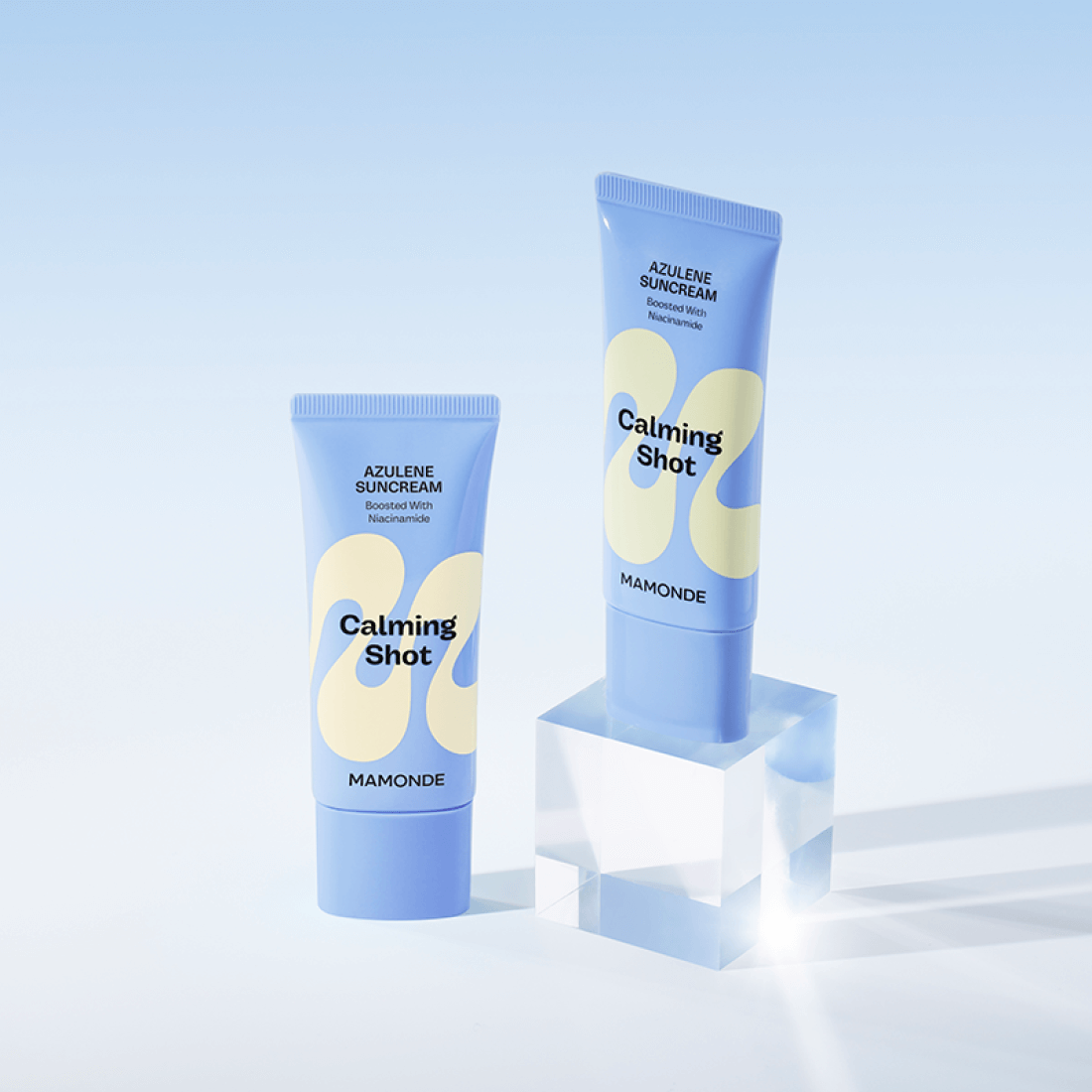 MAMONDE Calming Shot Azulene Sun Cream SPF50+PA++++ 35ml tubes displayed on a blue background