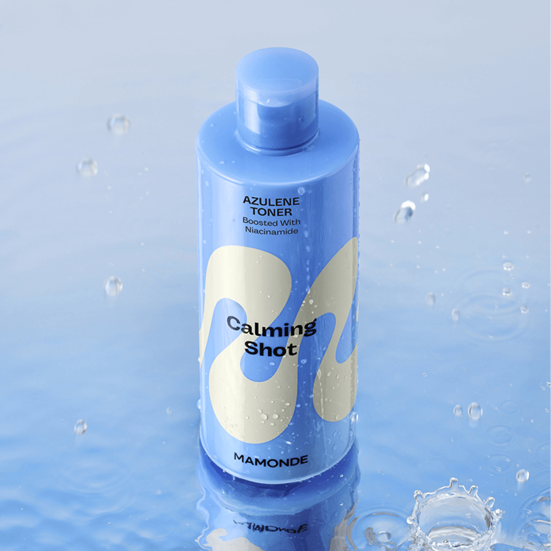 MAMONDE Calming Shot Azulene Toner 300ml bottle in water showcasing soothing properties and vibrant packaging.