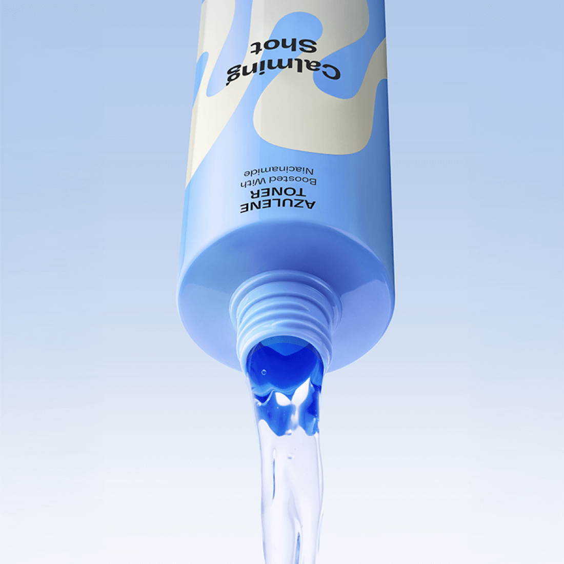 MAMONDE Calming Shot Azulene Toner 300ml bottle pouring blue liquid against light blue background.