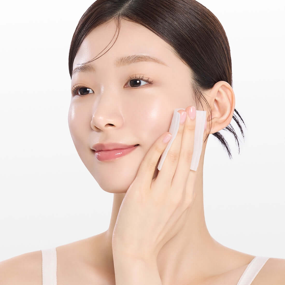 Woman applying MAMONDE Flora Glow Rose Water Toner 300ml with a cotton pad for glowing skin care