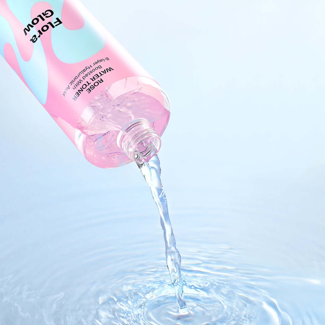MAMONDE Flora Glow Rose Water Toner 300ml being poured with water ripples
