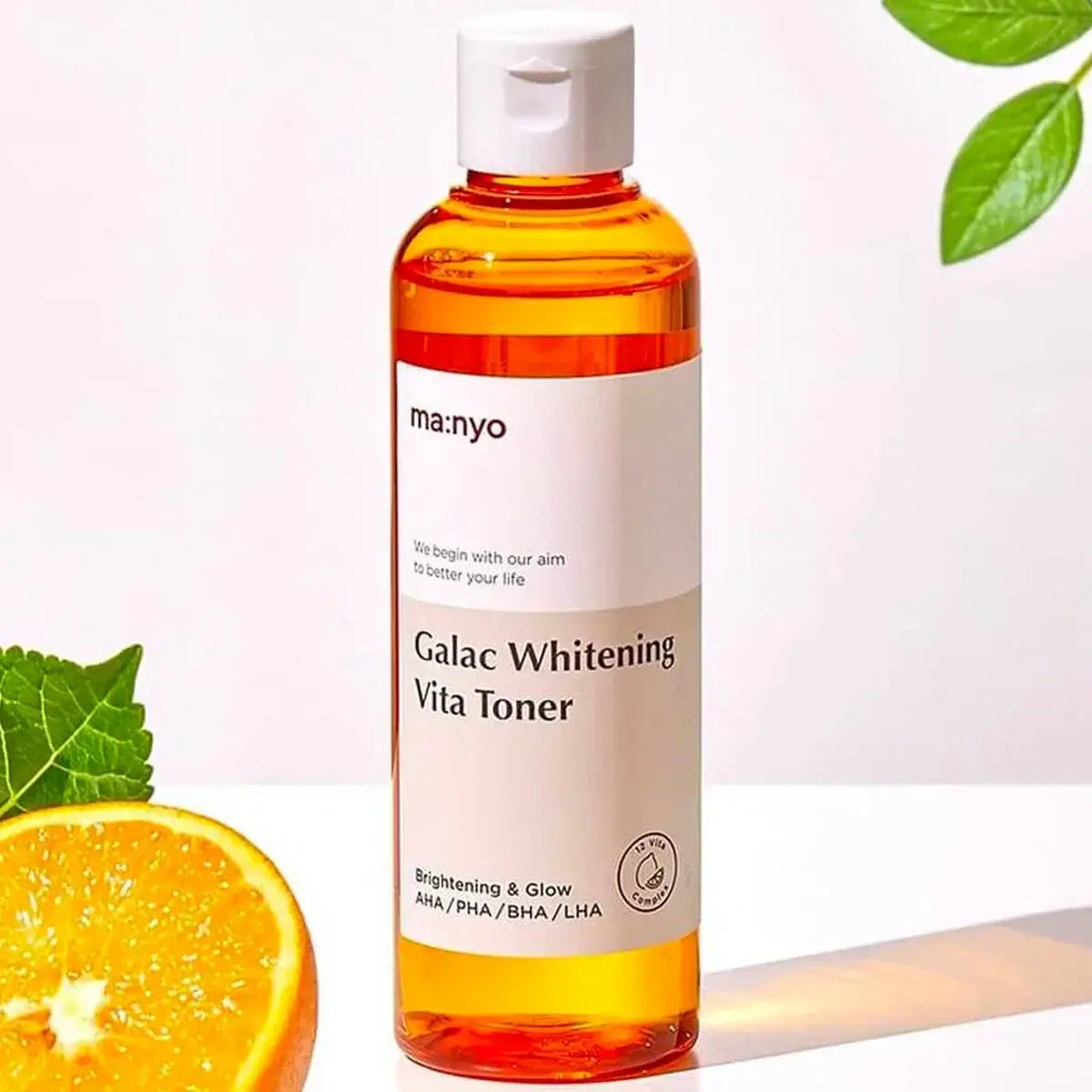 MA:NYO V Galac Whitening Vita Toner 210ml bottle with citrus and leaf accents, emphasizing brightening and glow properties.