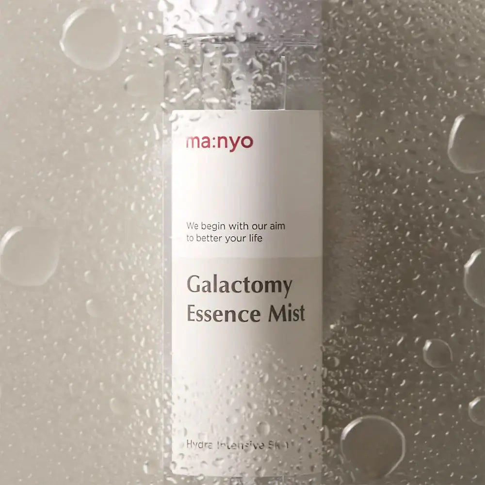 MANYO Galactomy Essence Mist 120ml, hydrating facial spray bottle with water droplets, skincare product display