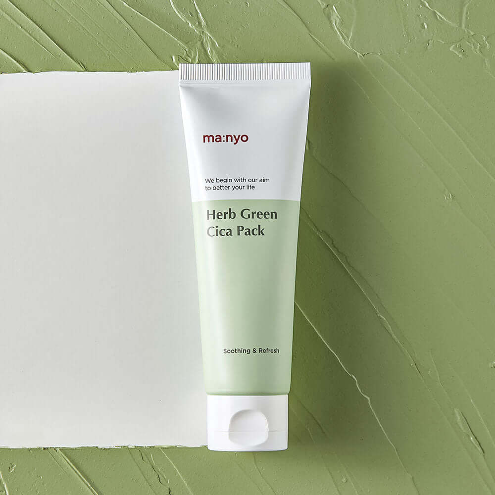 MANYO Herb Cica Pack 75ml product tube on green textured background.
