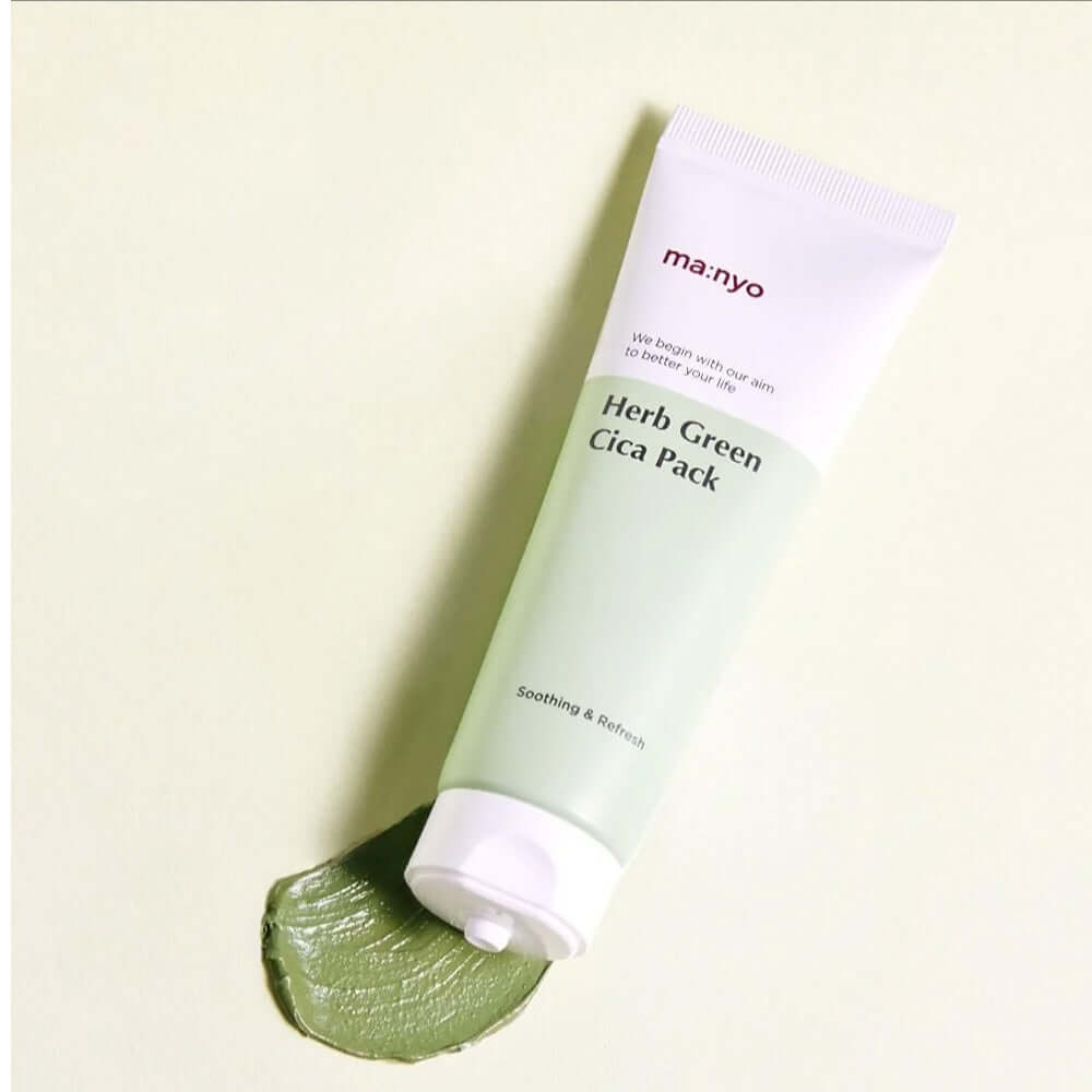 MANYO Herb Cica Pack 75ml tube on a soft green background, showcasing the product's soothing properties for skincare.