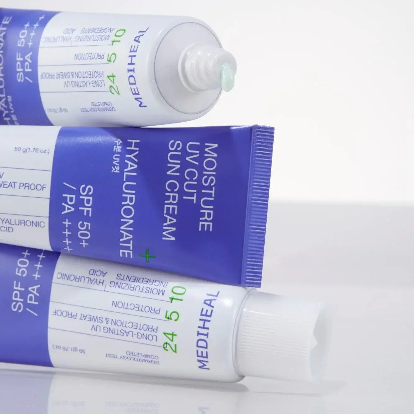 MEDIHEAL Moisture UV Cut Sunscreen 50ml showing tubes and cream texture