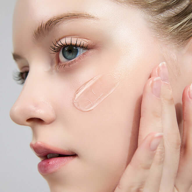 Close-up of person applying cream, showcasing MEDITHERAPY Inmotox Suction Jet (+Peptide Shot Cream) 50ml + EMS Device skincare regimen.