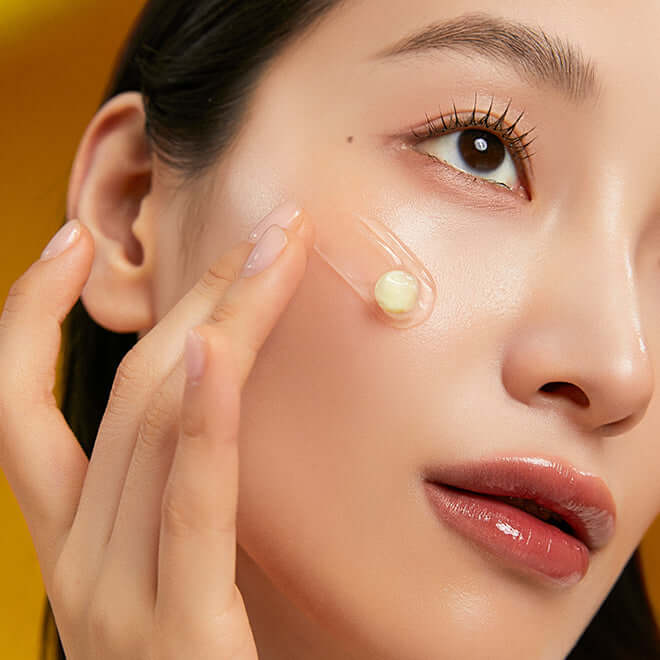 Woman applying MEDITHERAPY Melageran White Toning Cream 50ml + EMS Device on her cheek for smooth, radiant skin.