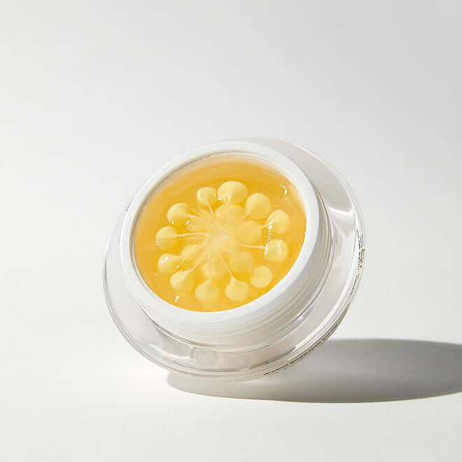 Close-up of MEDITHERAPY Melegran White Toning Cream Single Product 50ml showing the cream's unique texture in a clear jar.