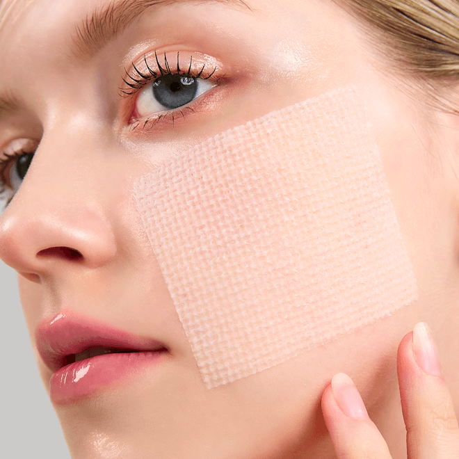 Woman using MEDITHERAPY Niacin X BHA Pore Mild Clear Pad 60 sheets on cheek for skincare treatment