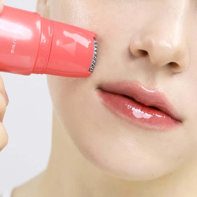 Woman applying MEDITHERAPY Philizio Pink Retinol Shot Serum 30ml to cheeks for skincare routine.