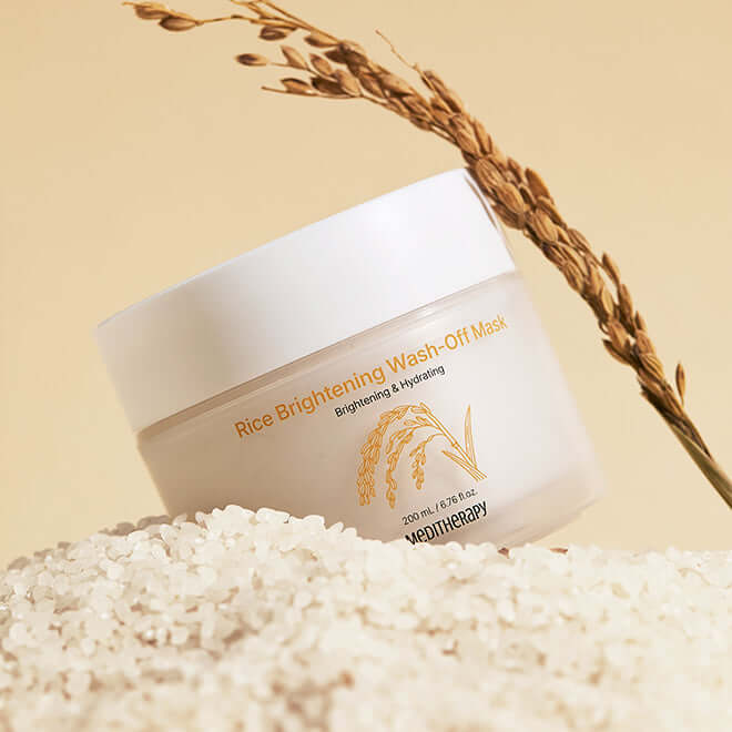 MEDITHERAPY Rice Brightening Wash-Off Mask 200ml on a bed of rice with plant stem, brightening skincare product image.