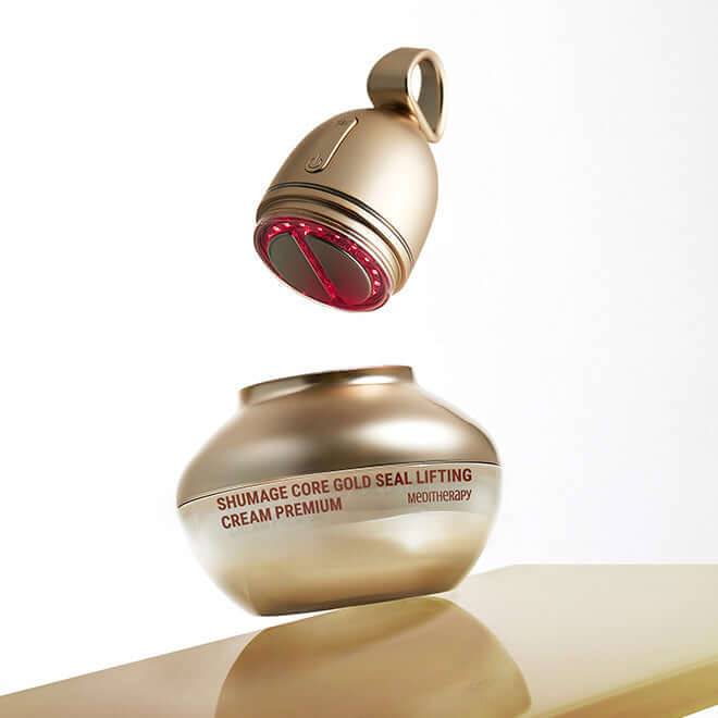 MEDITHERAPY Shumaji Core Goldsil Lifting Cream Premuim 50ml + EMS Device displayed on a reflective surface.