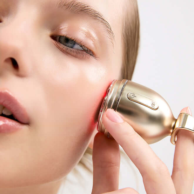 Woman using MEDITHERAPY Shumaji Core Goldsil Lifting Cream Premuim 50ml + EMS Device for skin lifting and rejuvenation