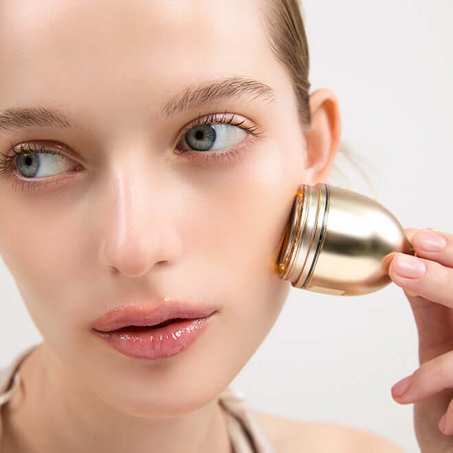 Woman using MEDITHERAPY Shumaji Core Goldsil Lifting Cream Premuim 50ml + EMS Device on face