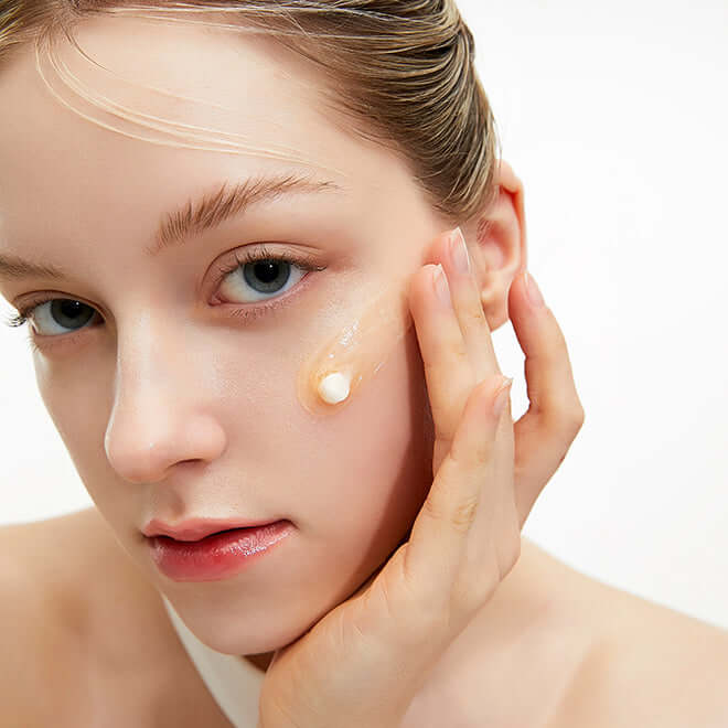 Person applying MEDITHERAPY Vita Real Toning Laser Cream 50ml on face for skincare routine.