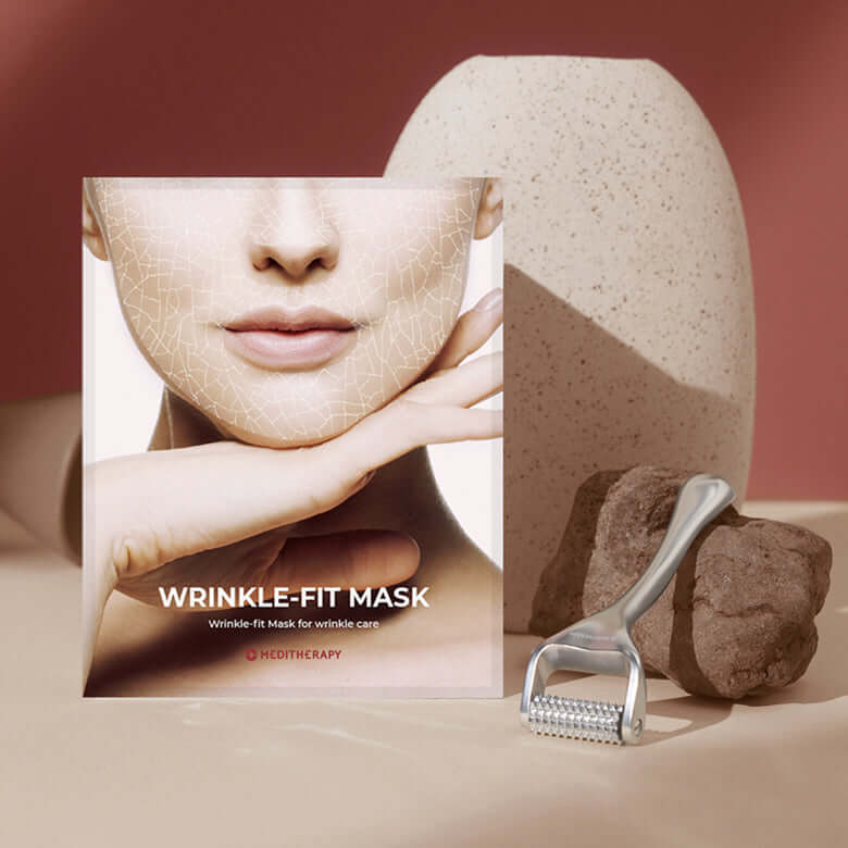 MEDITHERAPY Wrinkle-Fit Mask with dermaroller and skincare decor.