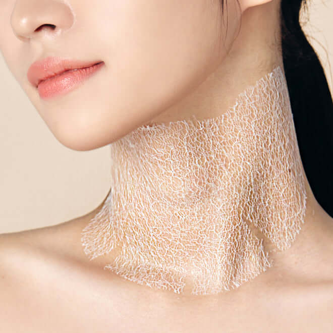 Woman using MEDITHERAPY Wrinkle Fit Neck Mask for smoother skin