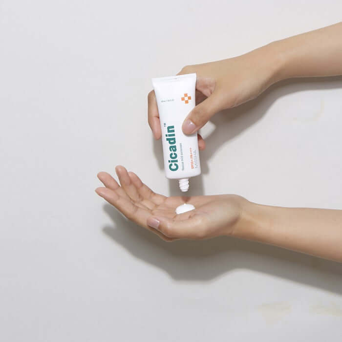 MISSHA Cicadin Rescue Mild Sunscreen 40ml being applied to hands for gentle protection.