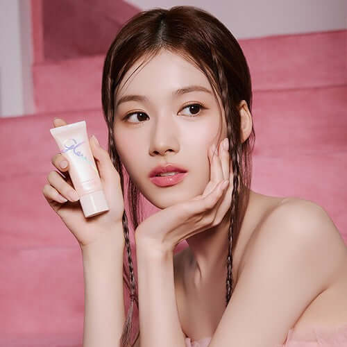 Woman holding MISSHA Glow Skin Balm 20ml in a pink setting