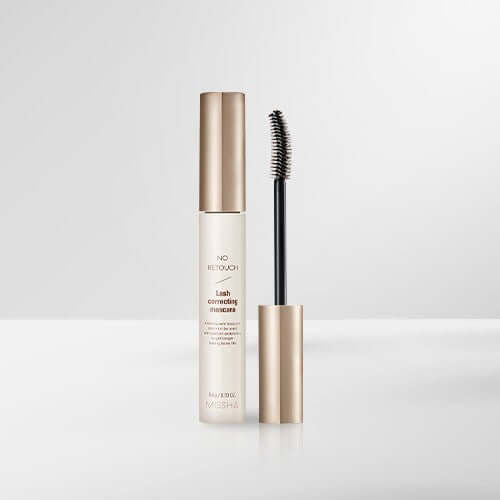 MISSHA No-Retouch Correction Cara mascara bottle and brush on white background.