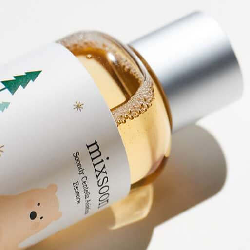 MIXSOON Soondy Centella Asiatica Essence 100ml bottle with decorative design on white background.
