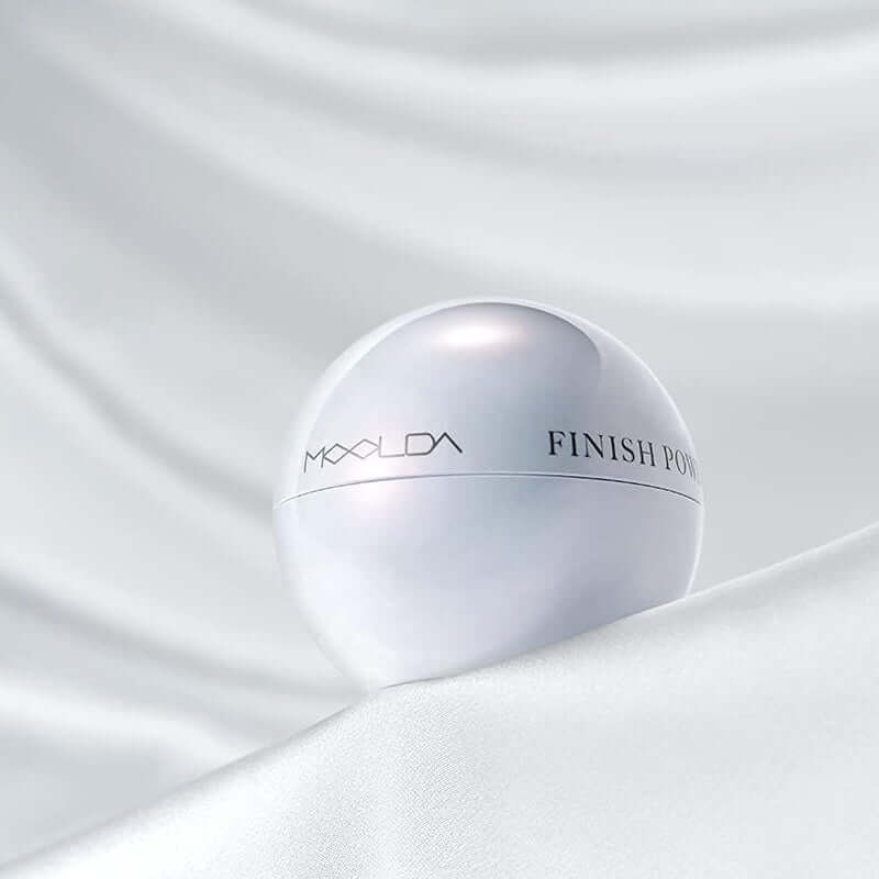 MOOLDA Water Finish Powder in a sleek round container on a white background.