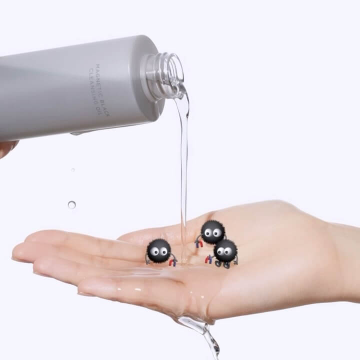 MOONSHOT Megnetic Black Cleansing Oil pouring onto hand with animated characters
