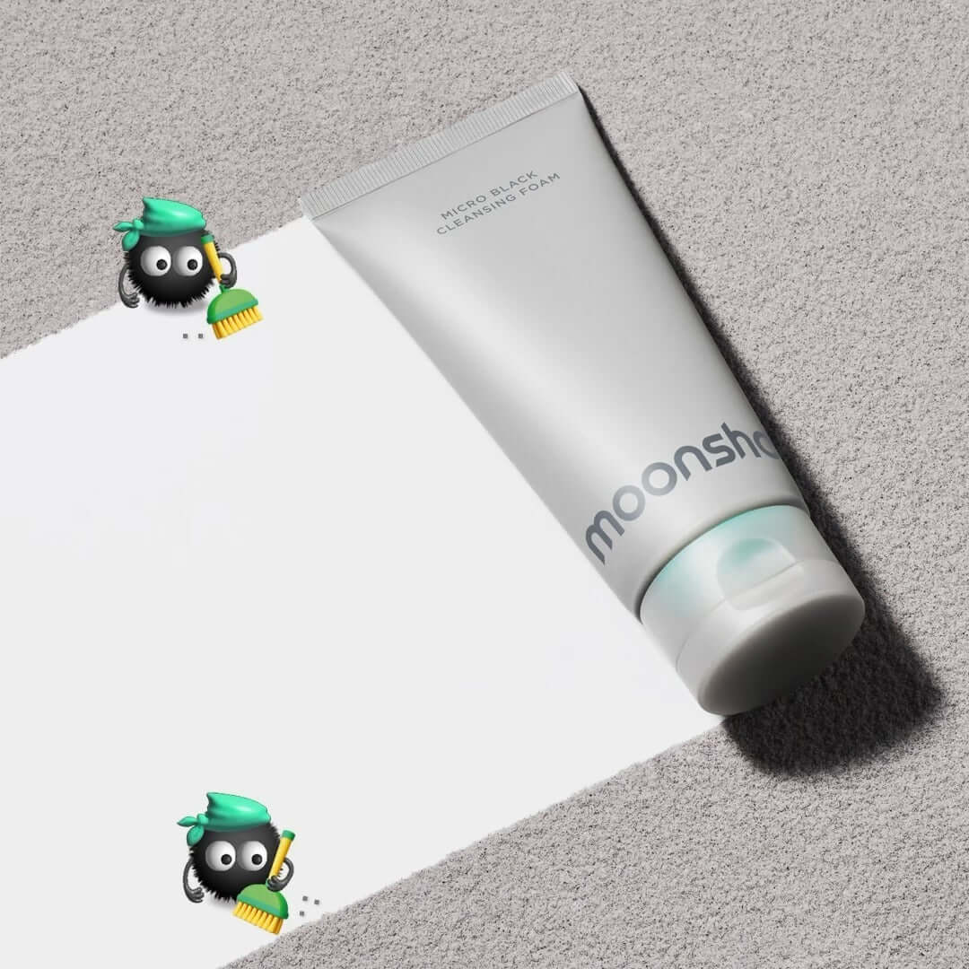 Image of MOONSHOT Micro Black Cleansing Foam tube on a light background with cartoon brushes.